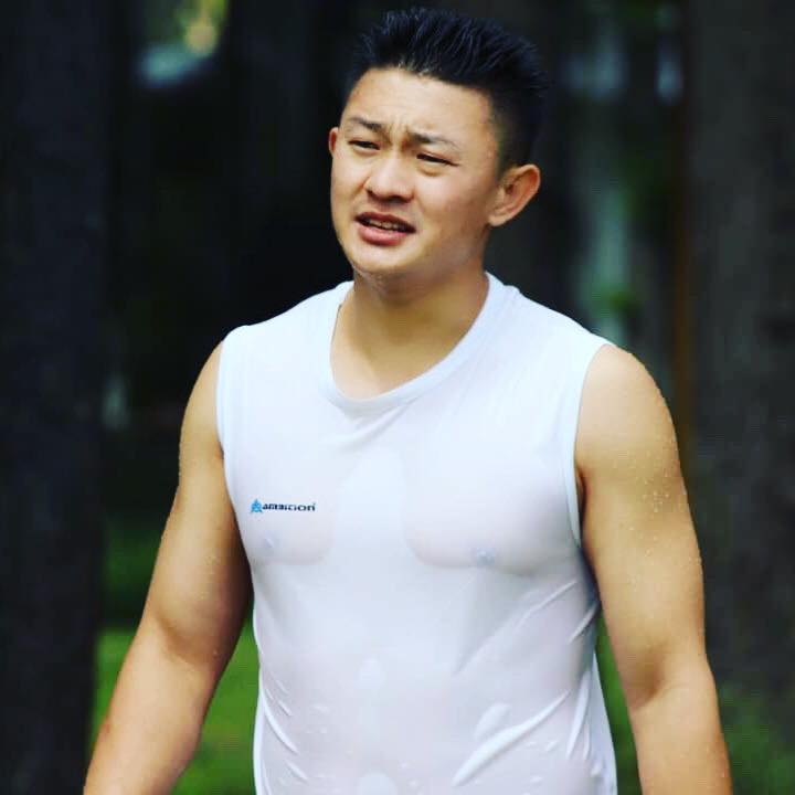 man standing with wet shirt